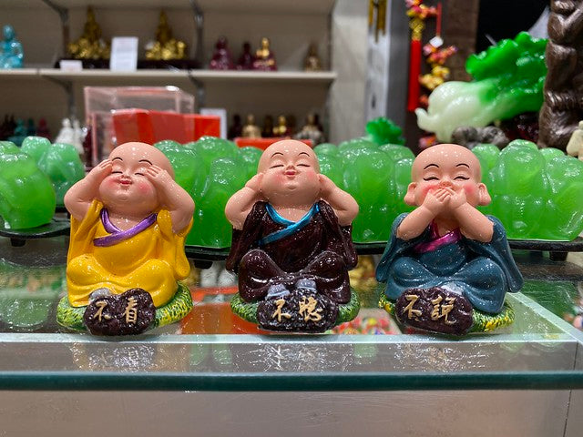 3 no evil monk figurines on store shelf