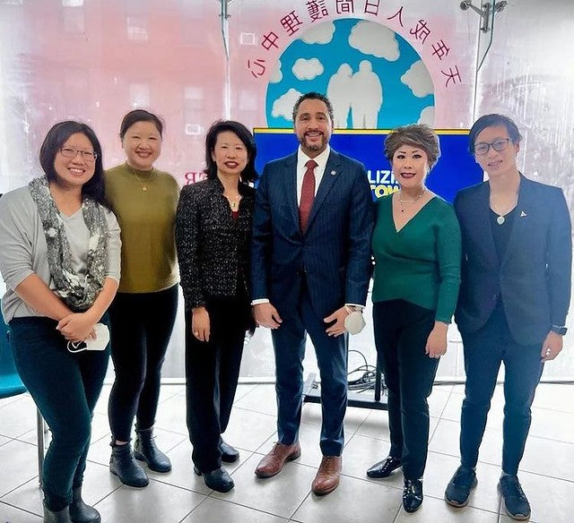 Members of the Light Up Chinatown committee and NYC politicians