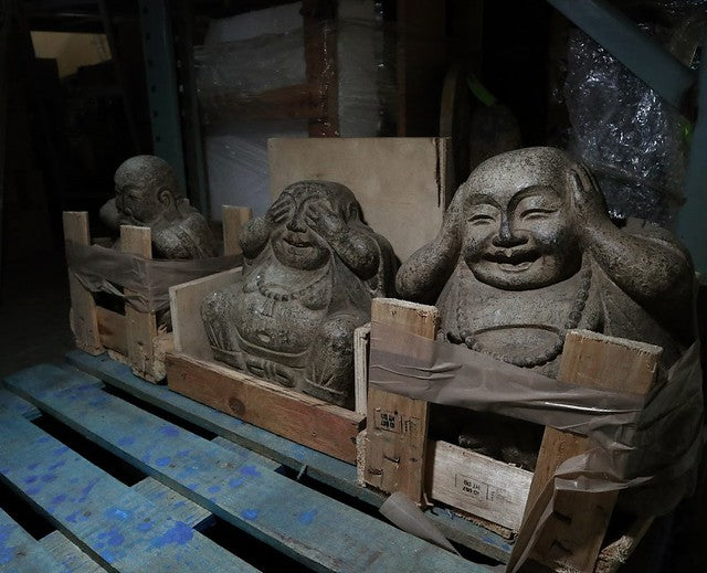 Three stone Buddha statues