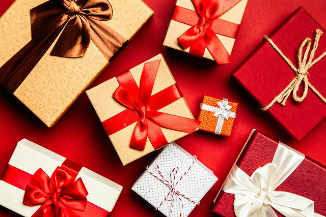 Array of gold and red wrapped gifts