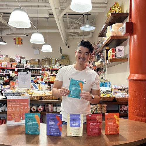 Reprise gummies founder with products at tasting in Pearl River Mart Foods