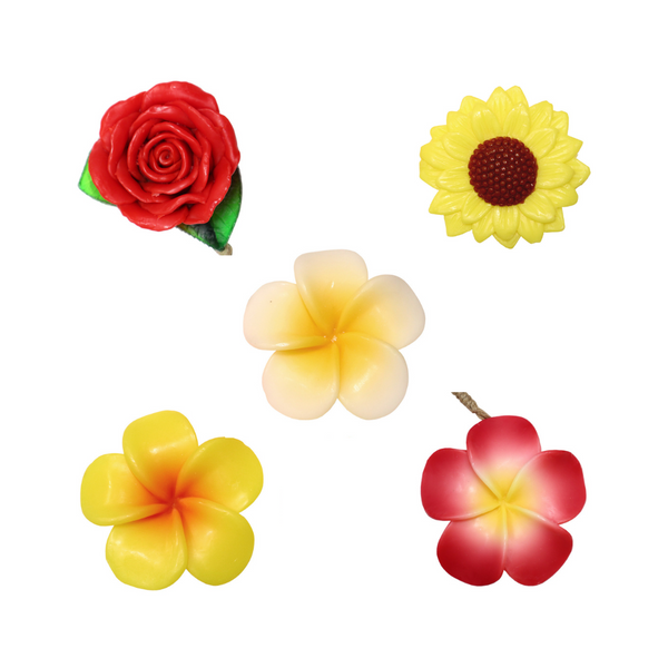 Five flower shaped soaps: rose, sunflower,  and yellow, white, and pink blossoms