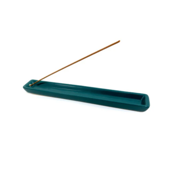 Blue-green ceramic incense tray holding an incense