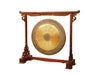 bulls eye brass gong hanging in gong stand